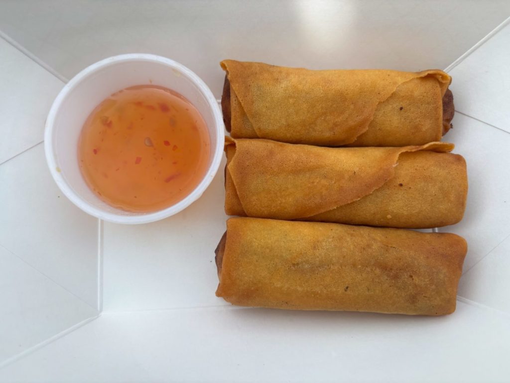 Three crispy egg rolls with sweet chili dipping sauce